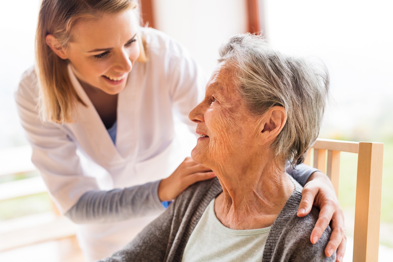 older woman and nurse