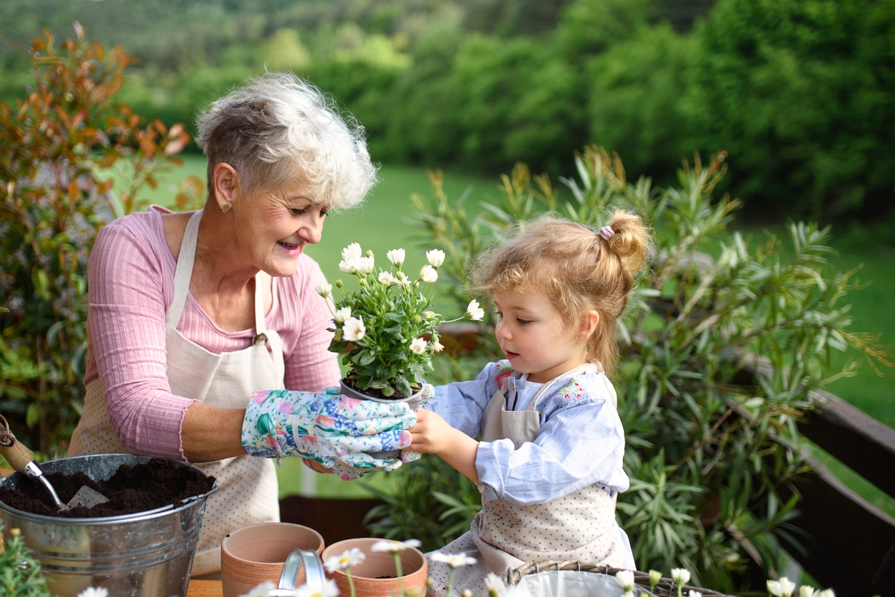 Grandmother & granddaughter gardening