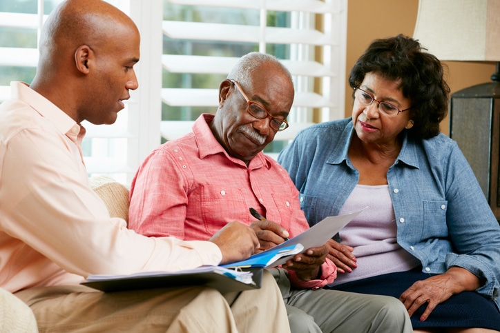 Seniors looking at documents