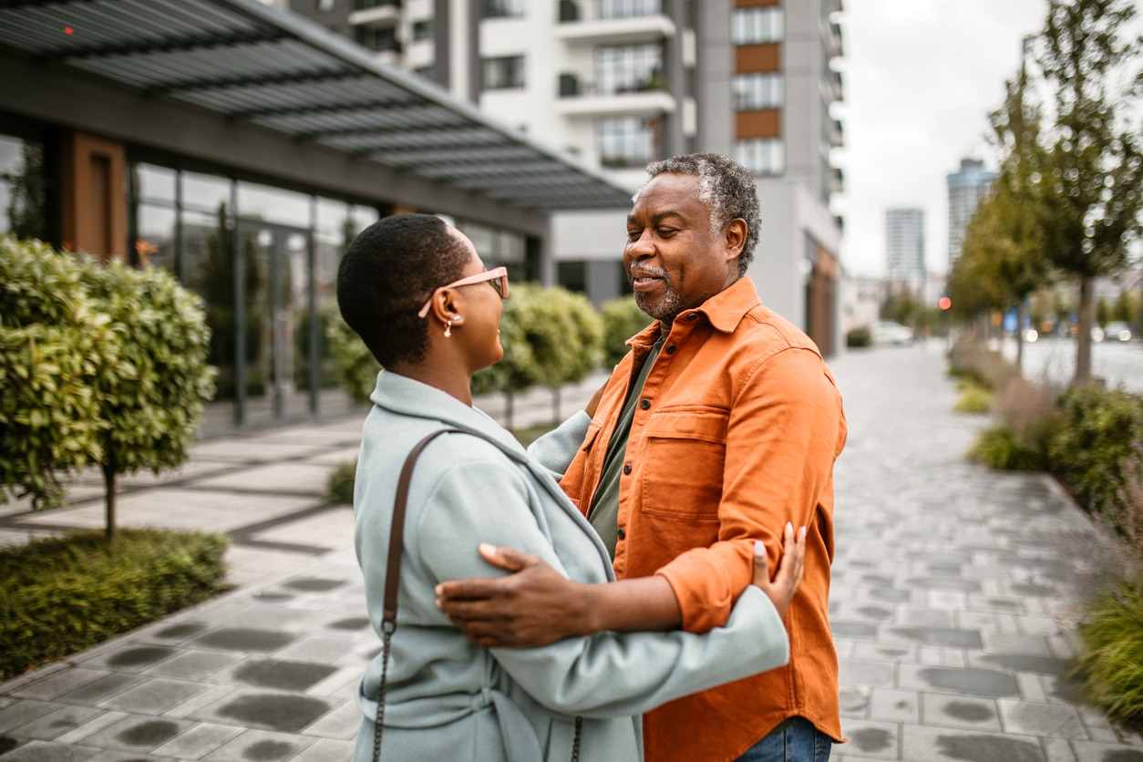 People embracing in the street